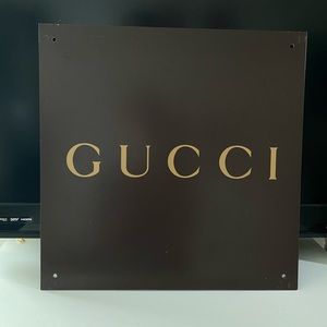 Gucci sign brown